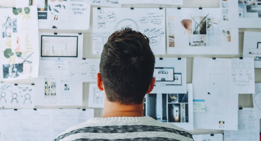 Person Looking at Pin Board